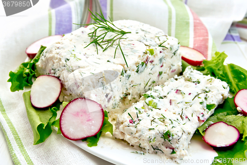 Image of Terrine of curd and radish with salad in plate on board