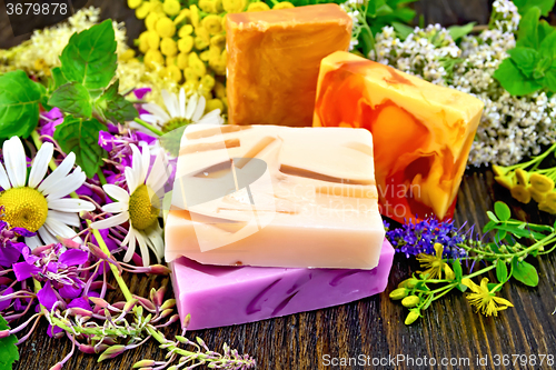 Image of Soap homemade with flowers on board