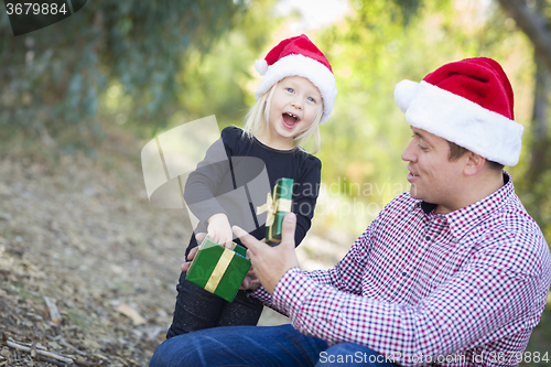 Image of Father Giving Young Daughter Christmas Gift