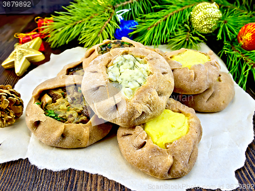 Image of Carols with different fillings on paper and xmas decorations