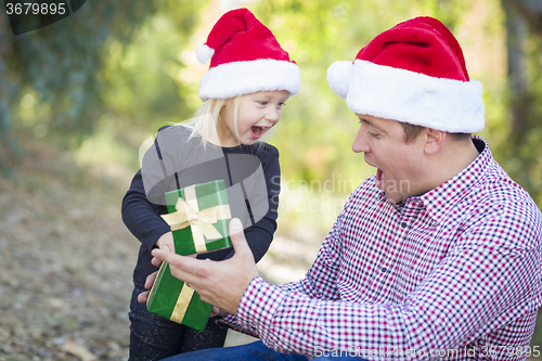 Image of Father Giving Young Daughter Christmas Gift