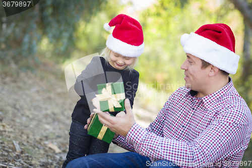 Image of Father Giving Young Daughter Christmas Gift