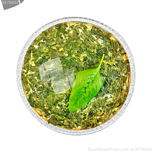 Image of Pie celtic with spinach leaves in form of foil