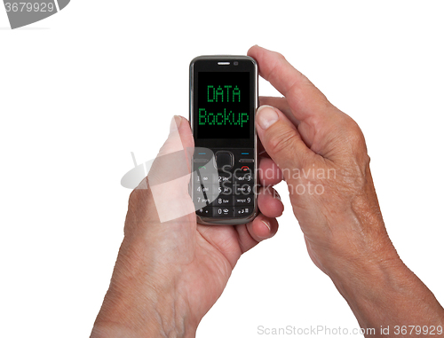 Image of Hands of senior woman with a mobile phone