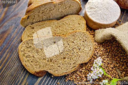 Image of Bread buckwheat with groats and flower on board