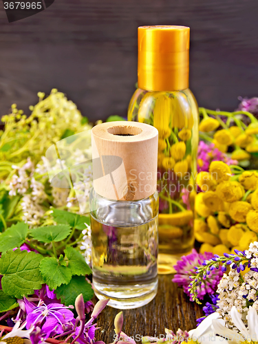 Image of Oil and lotion with flowers on board