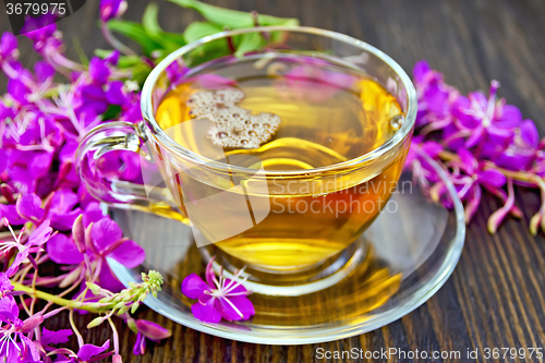 Image of Tea from fireweed in glass cup on dark board