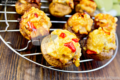 Image of Champignons stuffed with meat on lattice