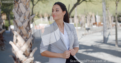 Image of Stylish young woman in an urban park