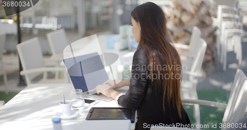 Image of Businesswoman typing on her laptop computer