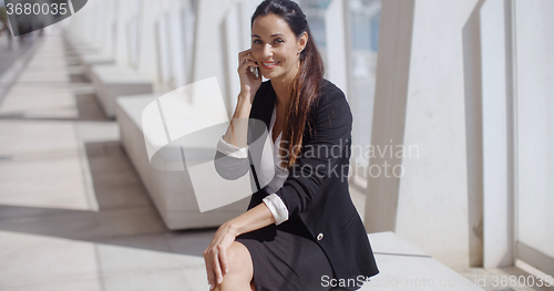 Image of Stylish young woman in a tropical town