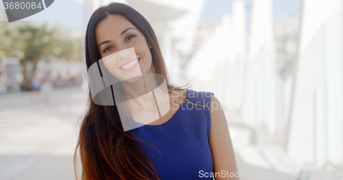 Image of Pretty friendly young brunette woman