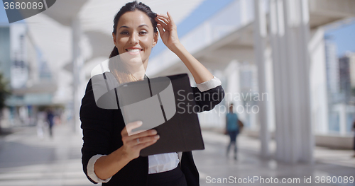 Image of Smiling woman surfing the internet