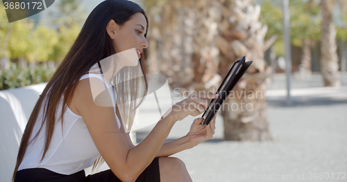 Image of Pretty young woman surfing the internet