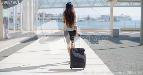 Image of Woman traveler in an urban street