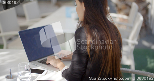 Image of Businesswoman typing on her laptop computer