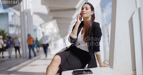 Image of Businesswoman taking a call on her mobile