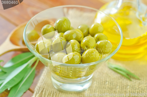 Image of green olives and oil
