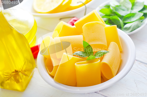 Image of raw pasta with aroma spice and oil in the bottle