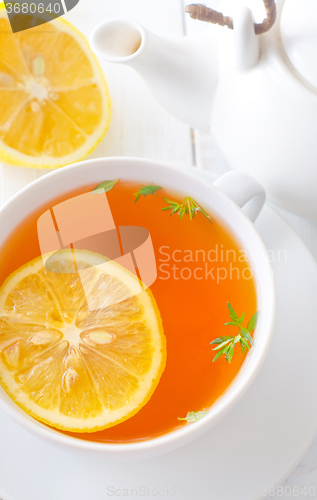 Image of Fresh tea with lemon in the white cup