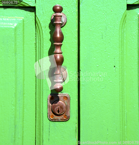 Image of spain   brass knocker lanzarote abstract door wood   