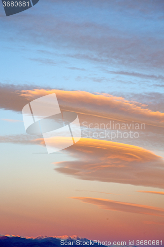 Image of sunrise in the colored sky white   clouds and  background