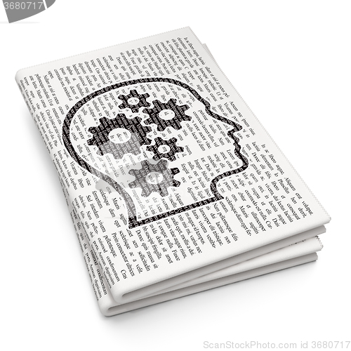 Image of Advertising concept: Head With Gears on Newspaper background