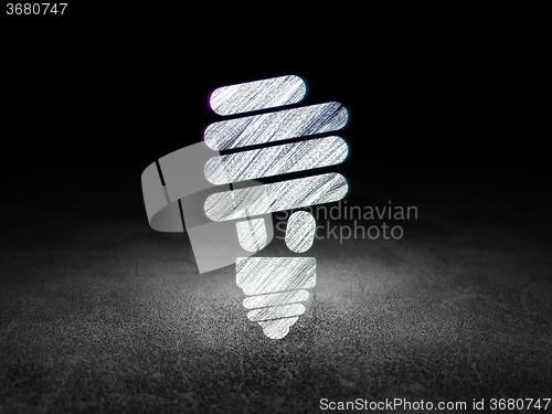 Image of Business concept: Energy Saving Lamp in grunge dark room