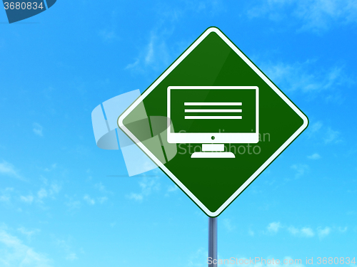 Image of Web development concept: Monitor on road sign background