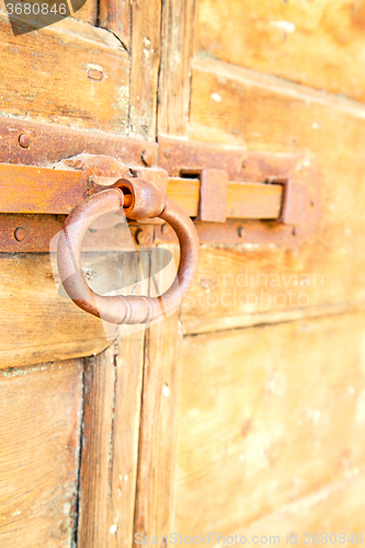 Image of europe old in  italy  door and rusty lock   