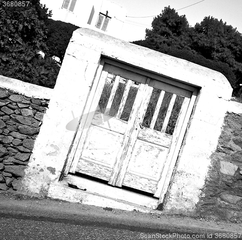 Image of blue door in  village  greece europe and    white wall