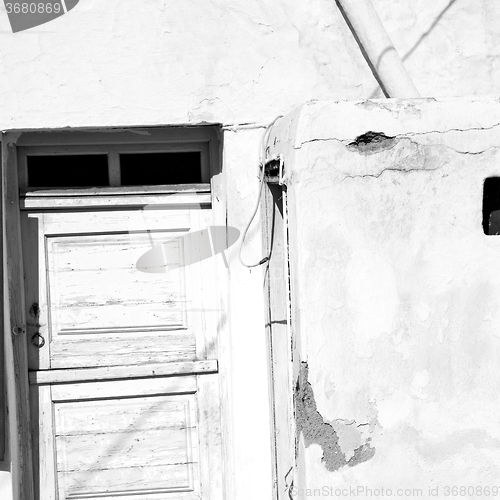 Image of blue door in antique village santorini greece europe and    whit