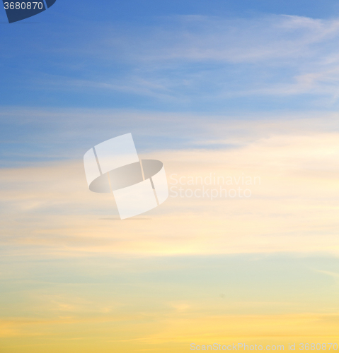 Image of sunrise in the colored sky white soft clouds and abstract backgr