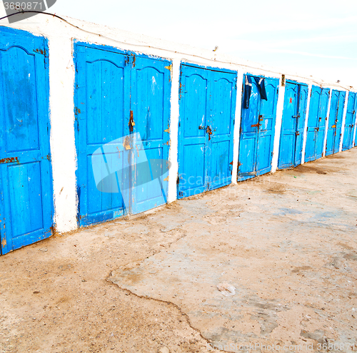 Image of in africa morocco  old harbor wood   door and the blue sky