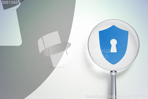 Image of Privacy concept:  Shield With Keyhole with optical glass on digital background