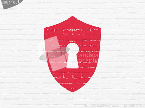 Image of Security concept: Shield With Keyhole on wall background