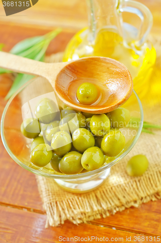 Image of green olives and oil