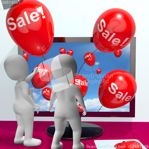 Image of Sale Balloons Coming From Computer Showing Internet Promotion An