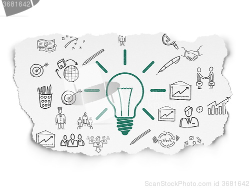 Image of Business concept: Light Bulb on Torn Paper background