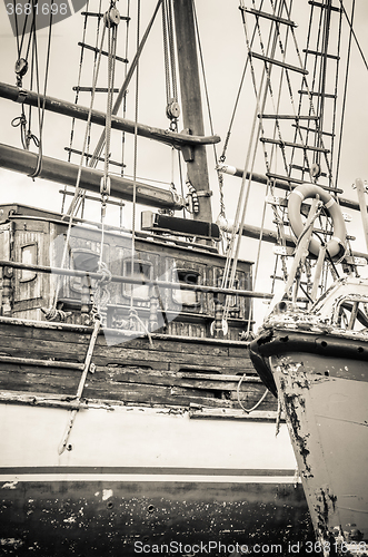 Image of Old collapsing sailboats at the dock, close-up