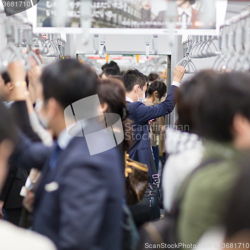 Image of Passengers traveling by Tokyo metro.