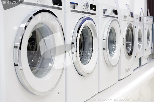 Image of washing mashines in appliance store