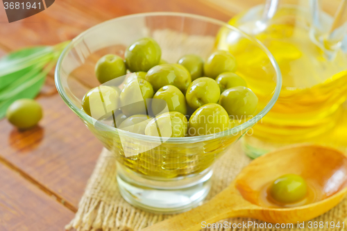 Image of green olives and oil