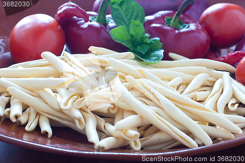 Image of Typical Calabrian pasta called " fileja " with chilli and tomato