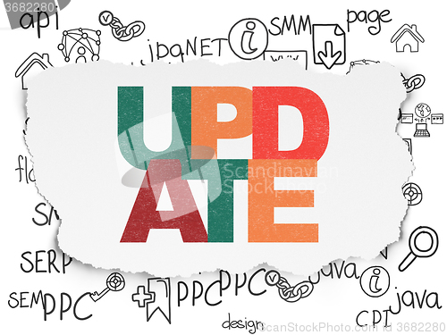 Image of Web development concept: Update on Torn Paper background