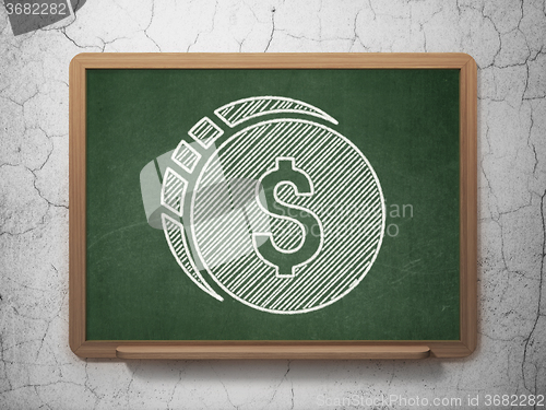 Image of Money concept: Dollar Coin on chalkboard background