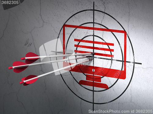 Image of Web development concept: arrows in Monitor target on wall background