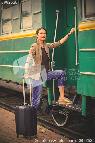 Image of woman at the door of an old railcar