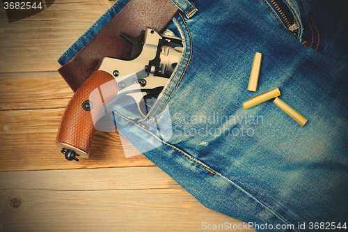 Image of revolver in the pocket