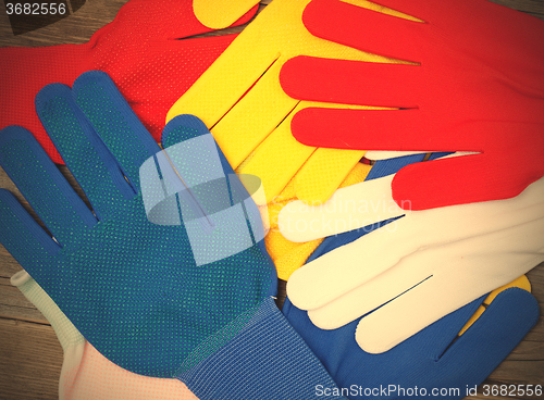 Image of varicolored workers gloves